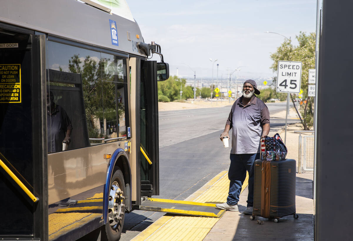 A man prepares to board a bus traveling along Boulder Highway on Thursday, June 8, 2023, in Hen ...