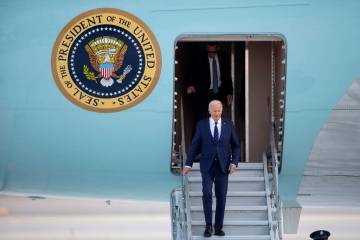 President Joe Biden exits Air Force One at Harry Reid International Airport, Monday, July 15, 2 ...