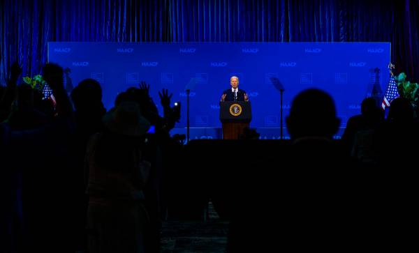 Attendees shout "4 more years" as President Joe Biden speaks during the 115th NAACP N ...
