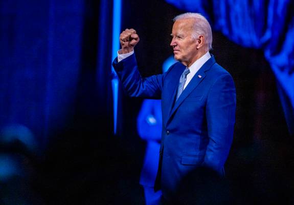 President Joe Biden pumps his fist to the crowd after speaking during the 115th NAACP National ...
