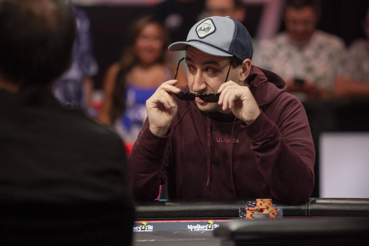 Jordan Griff puts on his glasses before competing in the final table of the World Series of Pok ...