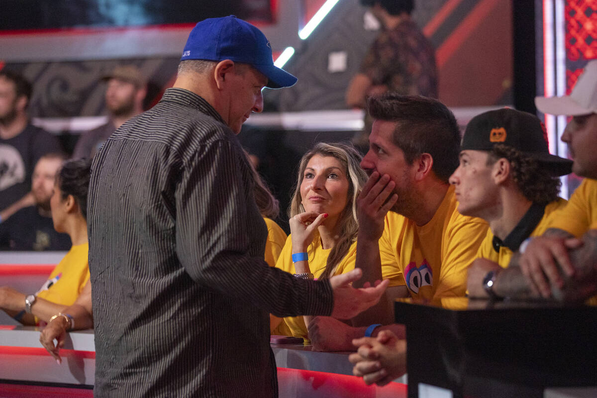 Jason Sagle, left, talks to family and friends during the final table of the World Series of Po ...