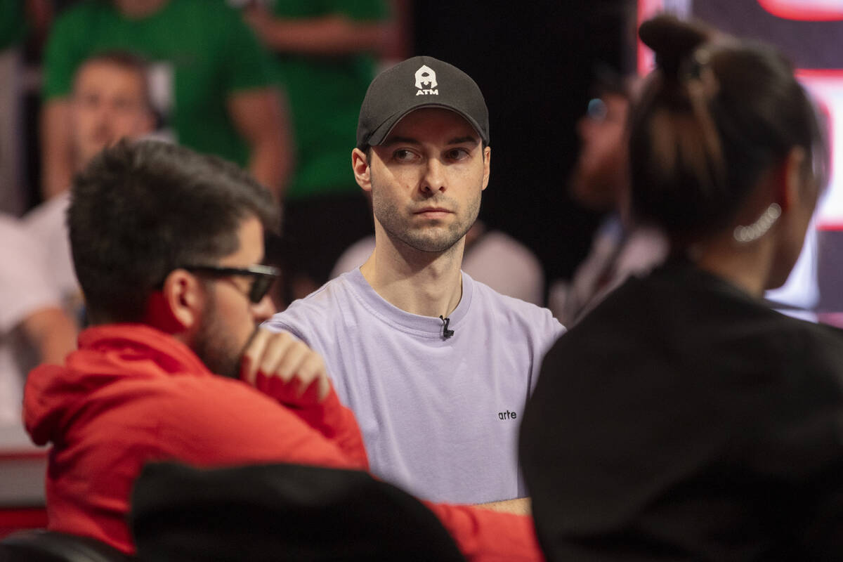 Malo Latinois checks the remaining time while competing in the final table of the World Series ...