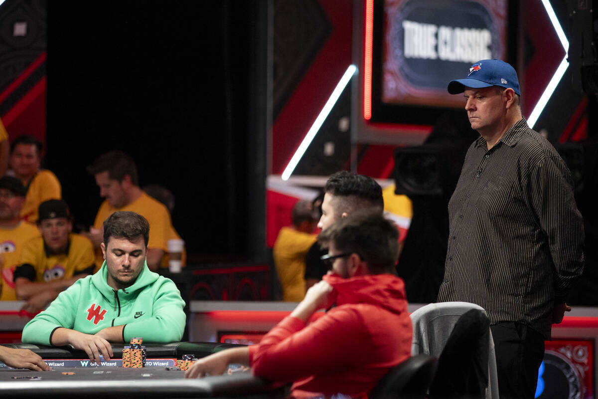 Jason Sagle, right, watch hands play in the final table of the World Series of Poker Main Event ...