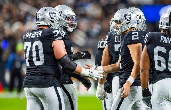 Raiders place kicker Daniel Carlson (2) thanks teammates after a score against the Los Angeles ...