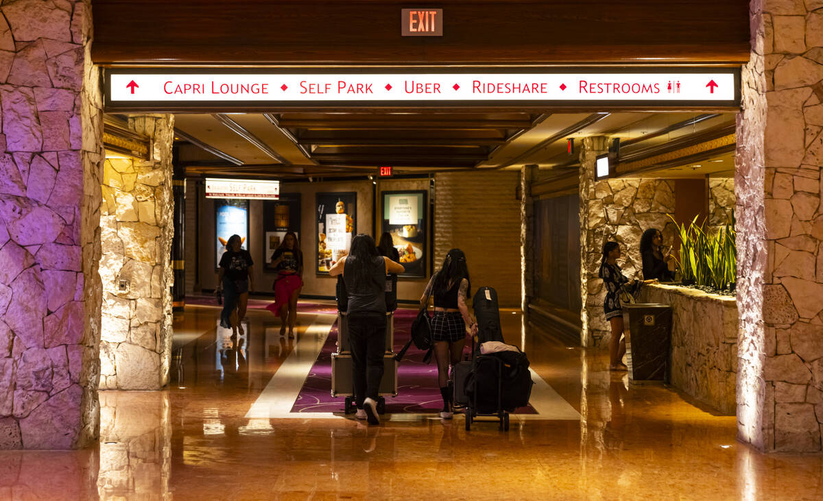 A pair of musicians make their way out during the final night of operations and gaming at The M ...