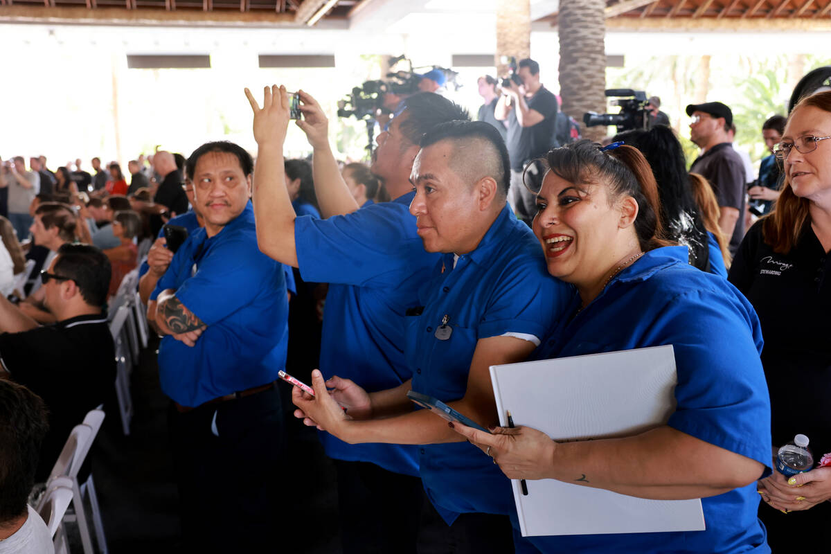 Stewards Angel Morales and Maria Romero, hug on the final day of operations at The Mirage on th ...