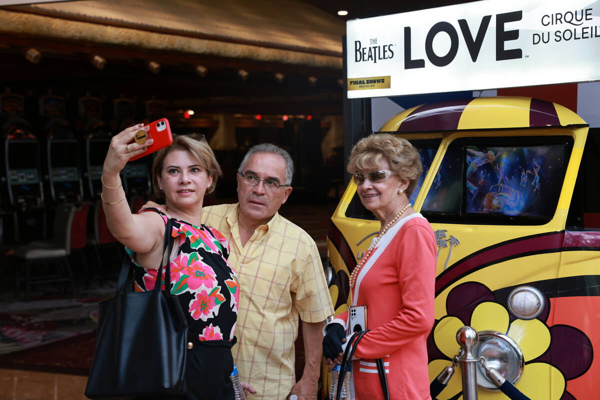 Guests take photos on the final day of operations at The Mirage on the Strip in Las Vegas Wedne ...