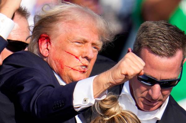 Republican presidential candidate former President Donald Trump reacts following an assassinati ...