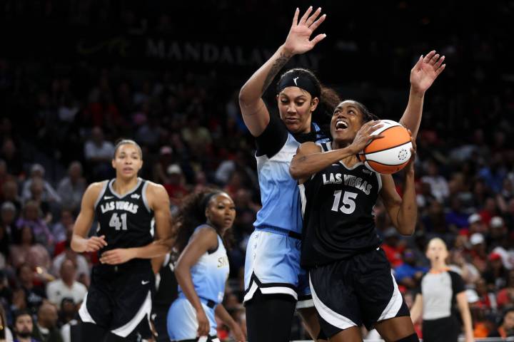 Las Vegas Aces guard Tiffany Hayes (15) shoots against Chicago Sky center Kamilla Cardoso (10) ...