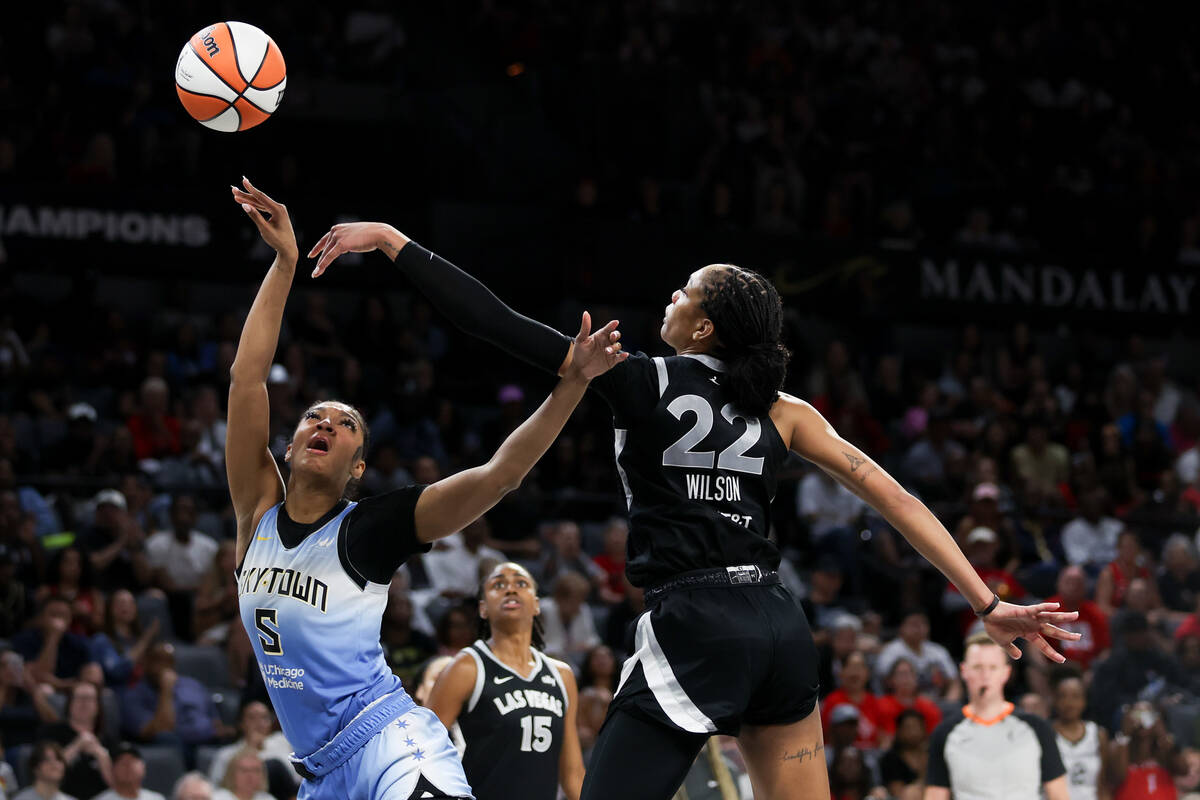 Las Vegas Aces center A'ja Wilson (22) blocks a shot by Chicago Sky forward Angel Reese (5) dur ...