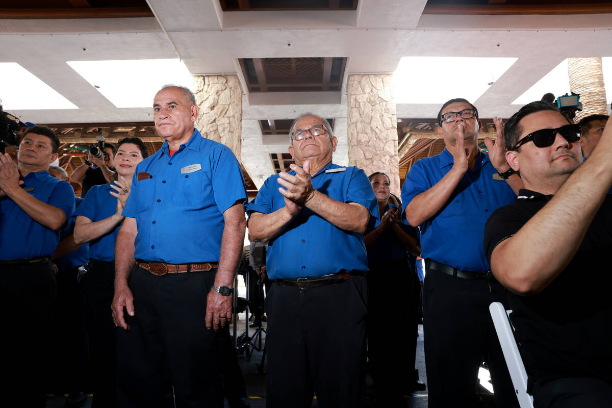 The Mirage employees take in the festivities on the final day of operations at the Strip resort ...