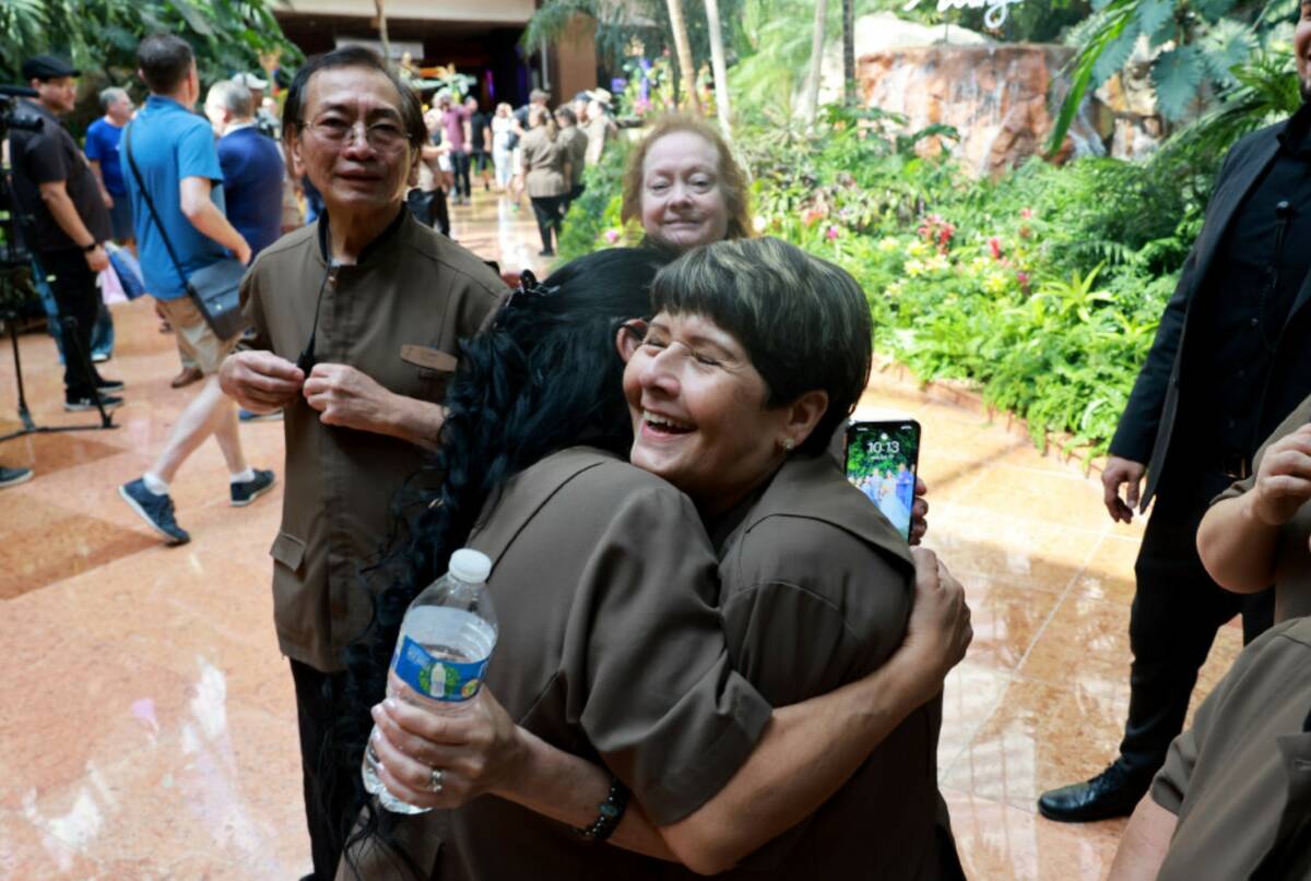 Casino porter Veronica Urbina, left, hugs Day 1 employee and fellow porter Lyceette Pagan on th ...