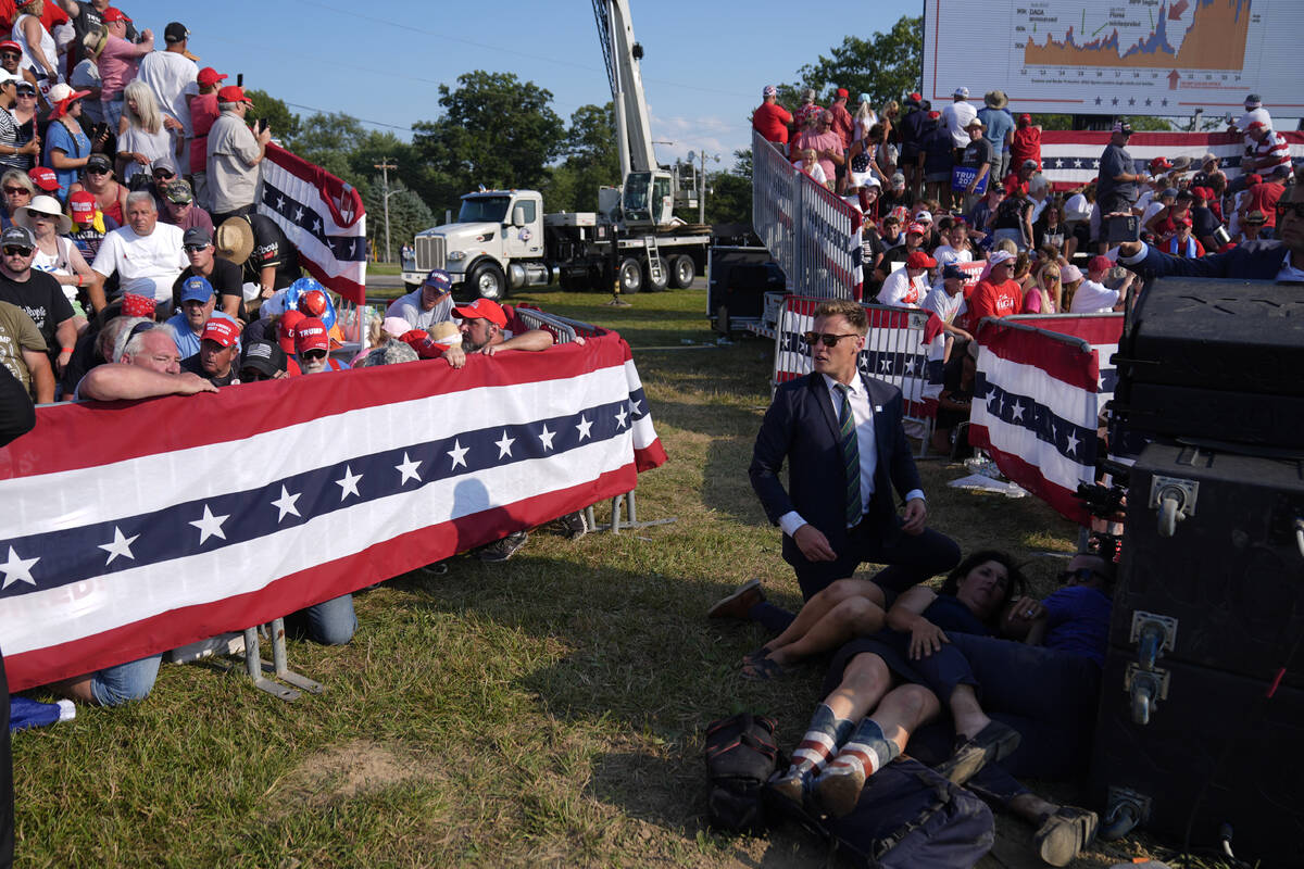 People react during a campaign rally with Republican presidential candidate former President Do ...