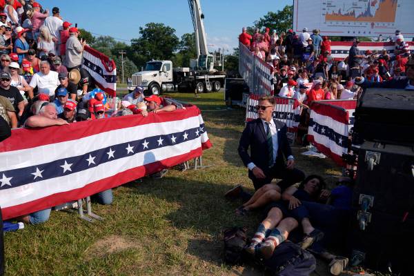 People react during a campaign rally with Republican presidential candidate former President Do ...