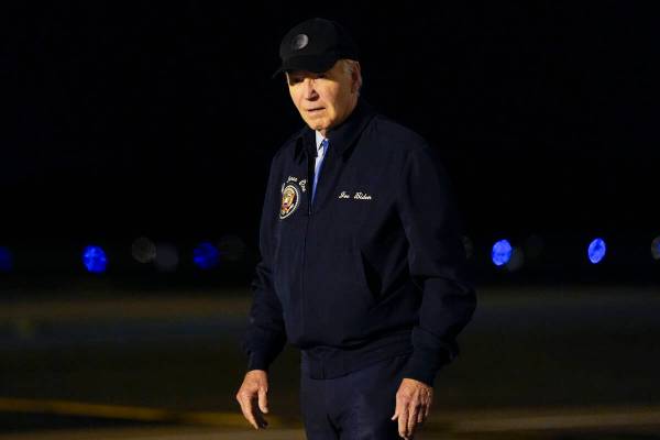 President Joe Biden walks to his car after stepping off of Air Force One at Dover Air Force Bas ...