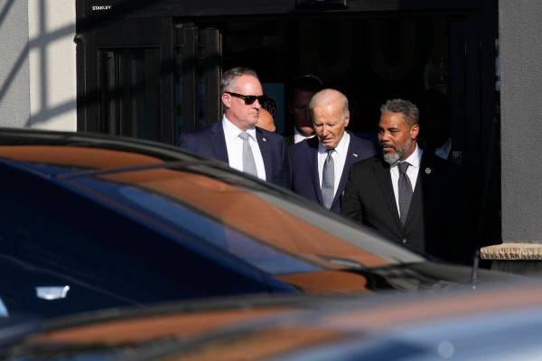 President Joe Biden leaves with Rep. Steve Horsford, D-Nev., after visiting Mario's Westside Ma ...