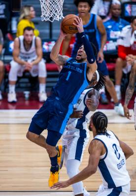 Memphis Grizzlies guard Scotty Pippen Jr. (1) goes up strong to the basket as New Orleans Pelic ...