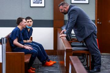 Adrian Rios, left, and brother Jessie Rios talks with attorney Charles Goodwin as their sentenc ...