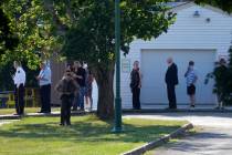 Visitors wait in line at the evening visitation session for Corey Comperatore, the former fire ...