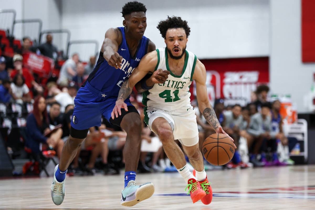 Boston Celtics guard Jaelen House (41) dribbles up the court against Dallas Mavericks guard Jaz ...