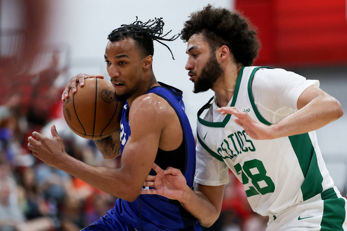 Dallas Mavericks guard AJ Lawson, left, drives toward the hoop against Boston Celtics forward A ...