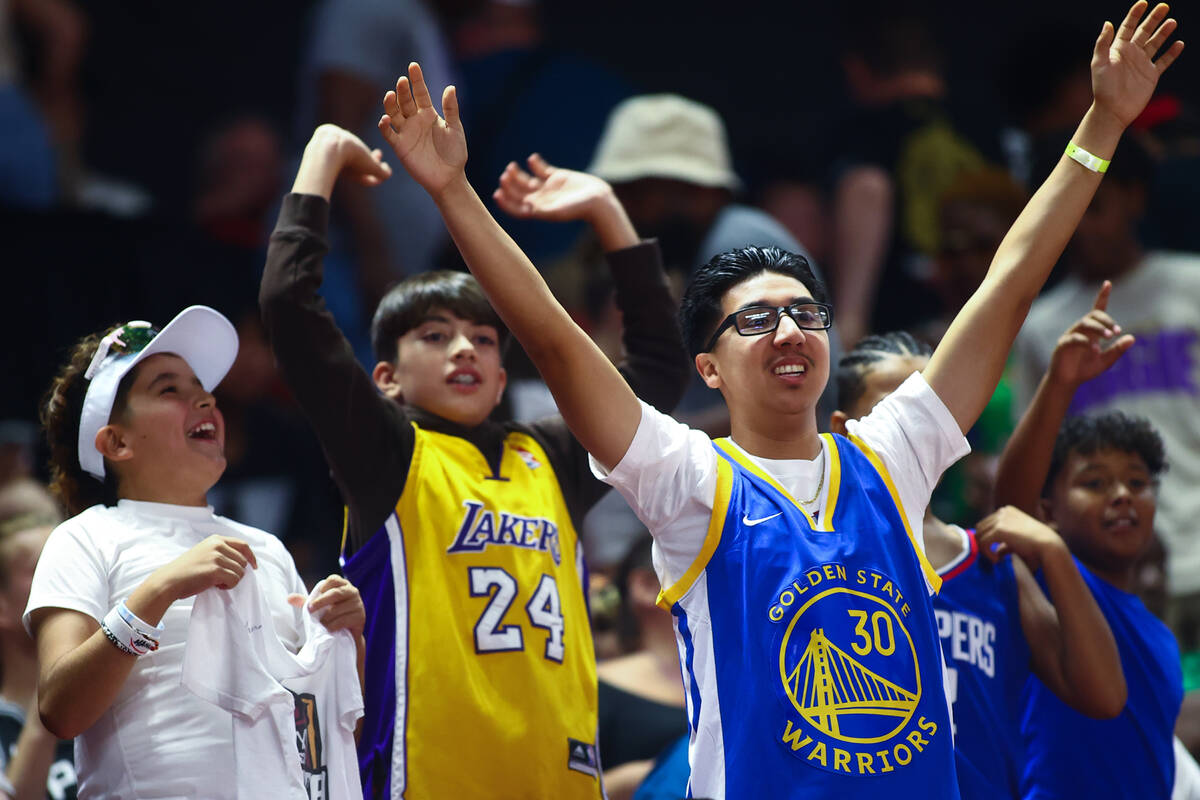 Fans cheer during an NBA summer league basketball game between the San Antonio Spurs and the P ...