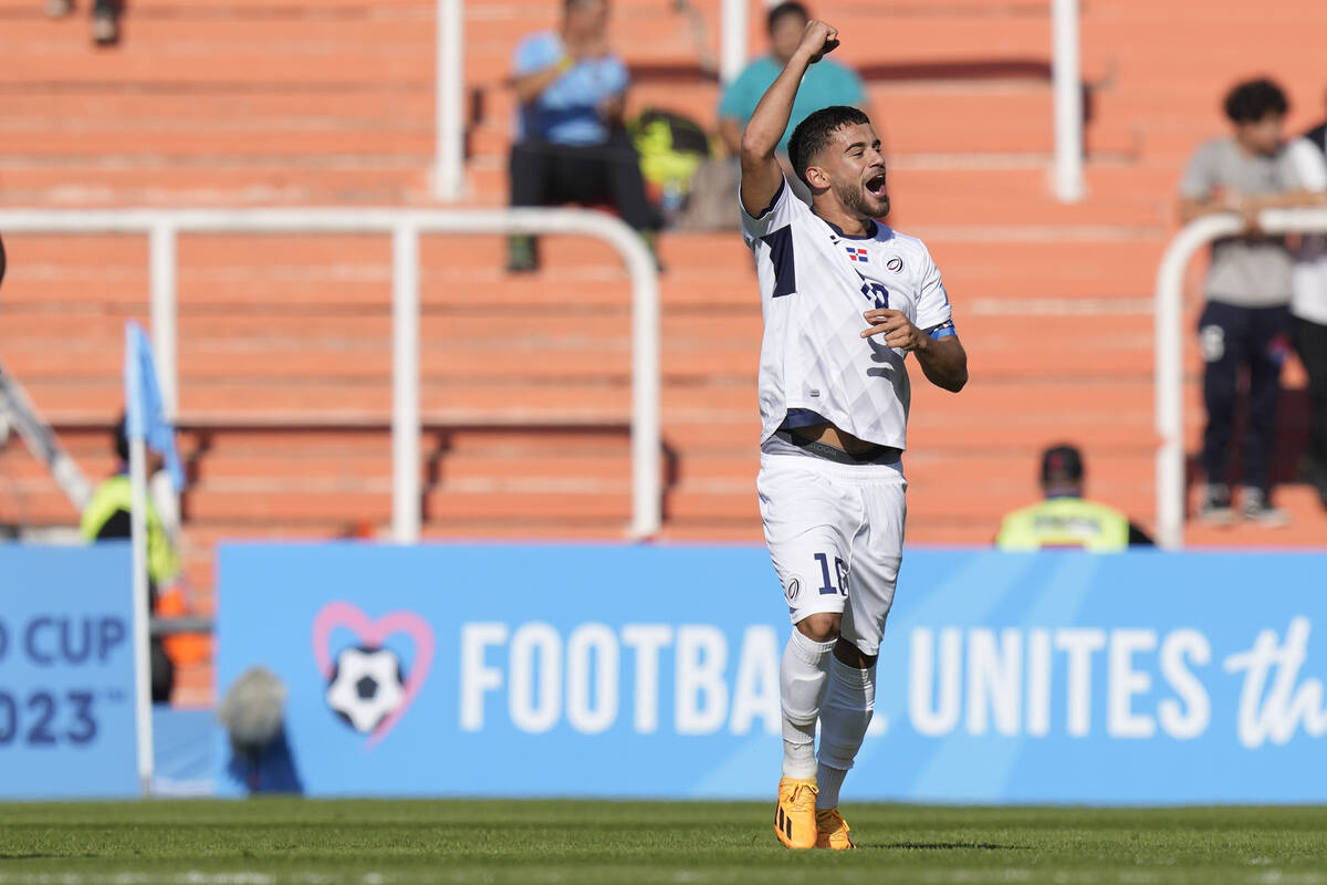 Dominican Republic's Edison Azcona celebrates scoring the opening goal against Nigeria during a ...