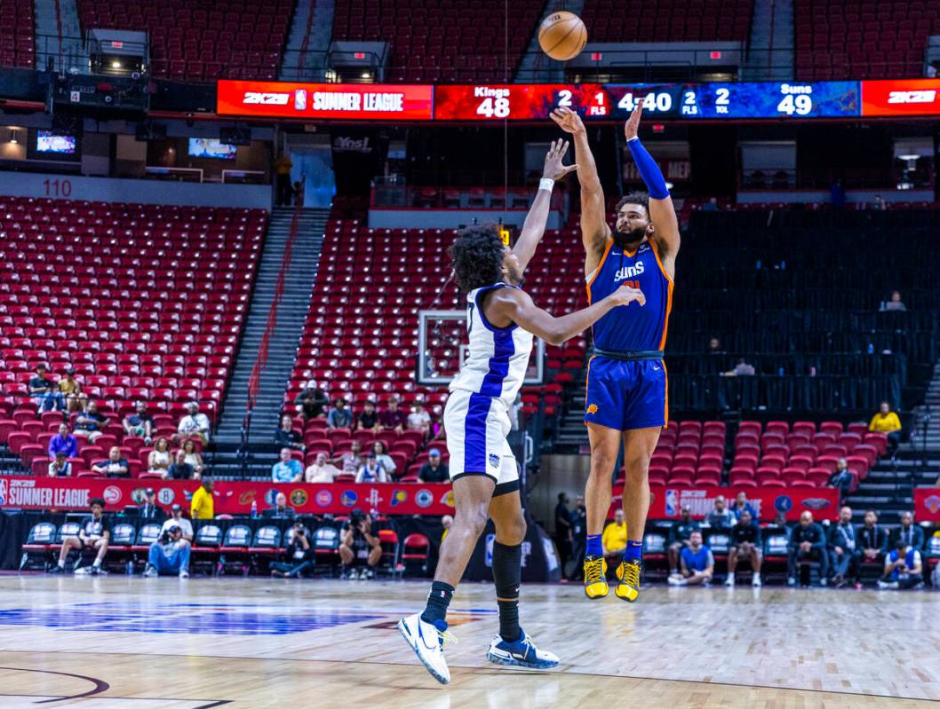 Phoenix Suns forward David Roddy (21) elevates for a shot over Sacramento Kings forward Isaac J ...
