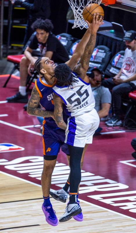 Phoenix Suns guard Michael Devoe (45) blocks a shot by Sacramento Kings guard Ahmad Caver (55) ...
