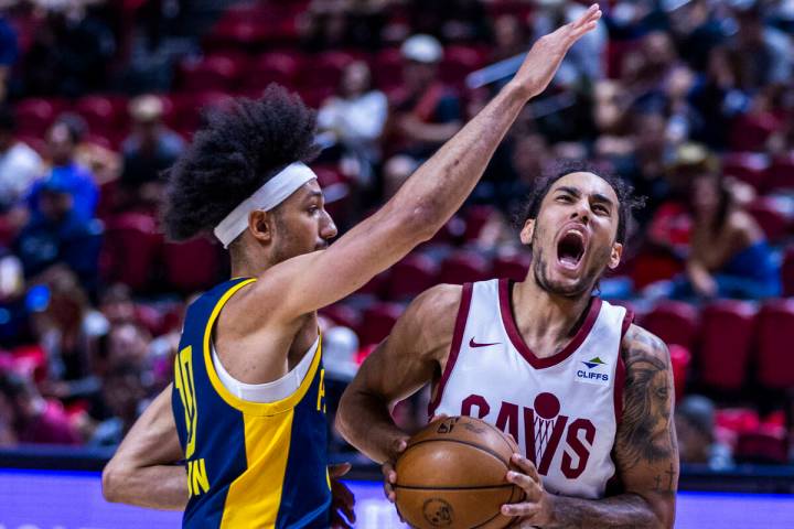 Cleveland Cavaliers guard Jaylon Tyson (24) takes a foul from Indiana Pacers center Indiana Pac ...