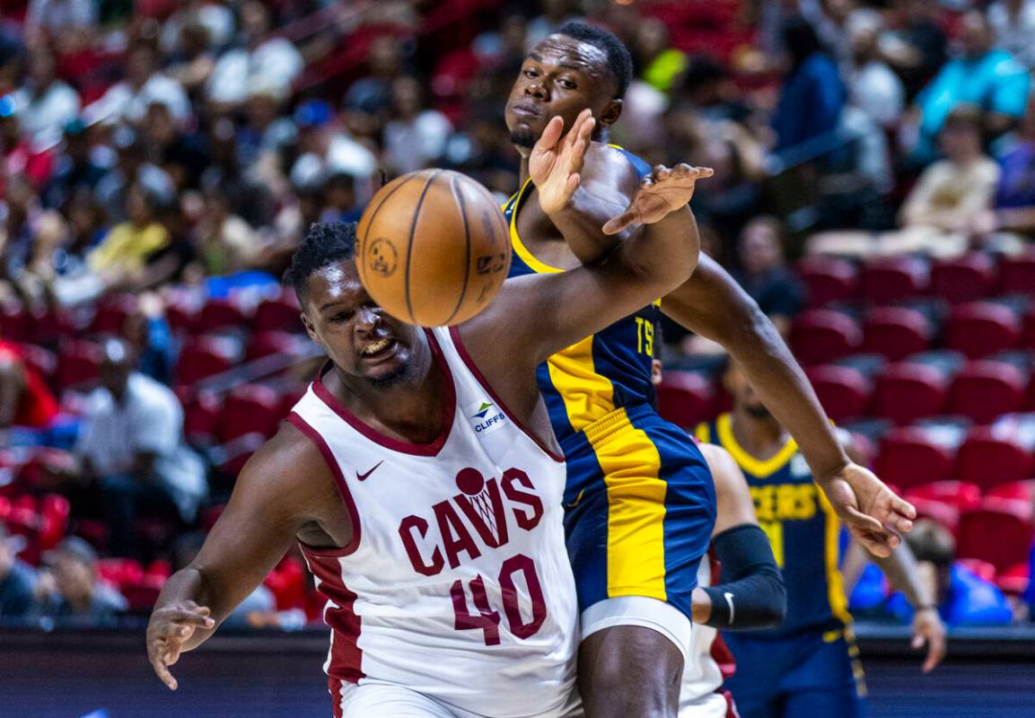 Cleveland Cavaliers center DJ Burns (40) chases a loose ball with Indiana Pacers center Oscar T ...