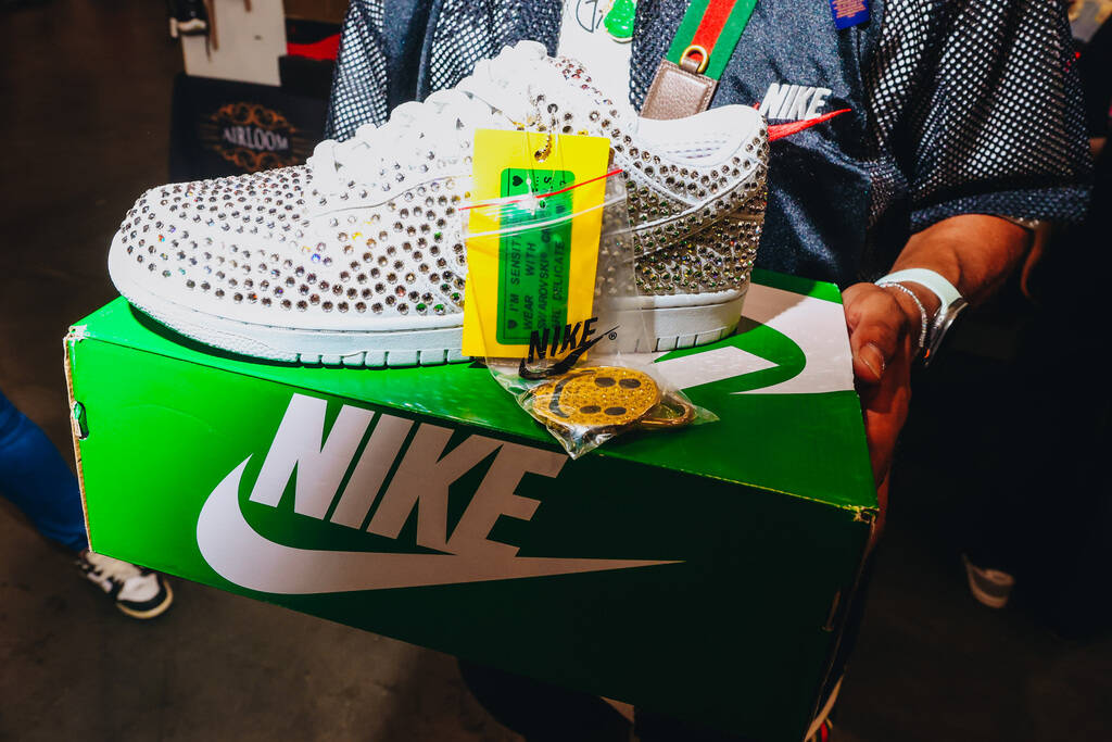 Nike Dunk Low shoes from a Cactus Plant Flea Market and Swarovski collab are seen during Sneake ...