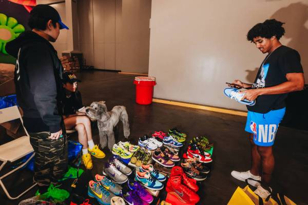 An attendee checks out some Nike sneakers being sold during Sneaker Con at the Mandalay Bay Con ...