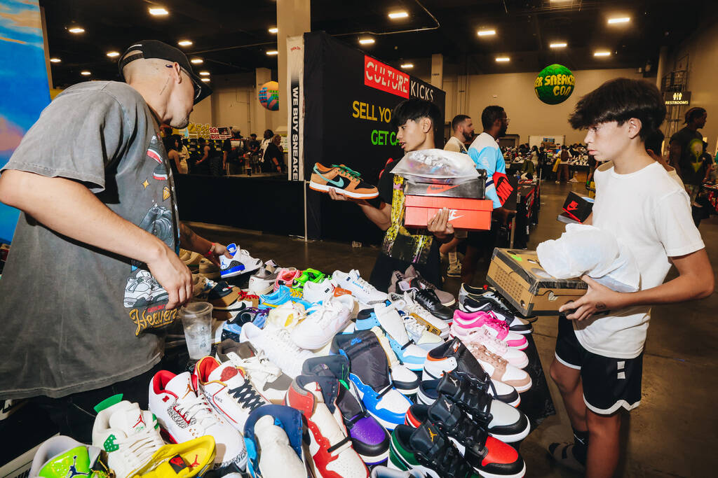 Attendees shop for shoes during Sneaker Con at the Mandalay Bay Convention Center on Saturday, ...