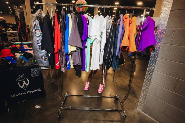 An attendee looks through a clothing rack during Sneaker Con at the Mandalay Bay Convention Cen ...