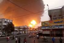 In this image from video, smoke and flames rise from a site in Hodeidah, Yemen, on Saturday, Ju ...