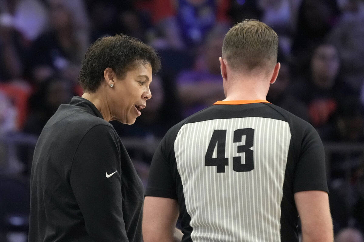 Team WNBA head coach Cheryl Miller, left, argues with referee Kevin Fahy (43) during the second ...