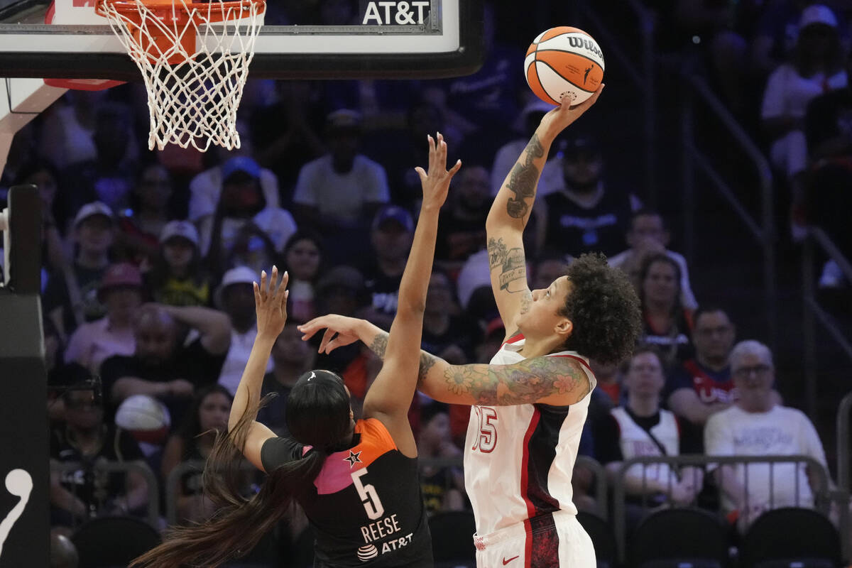 Brittney Griner (15), of Team USA, shoots over Angel Reese (5), of Team WNBA, during the second ...