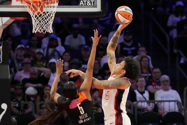 Brittney Griner (15), of Team USA, shoots over Angel Reese (5), of Team WNBA, during the second ...