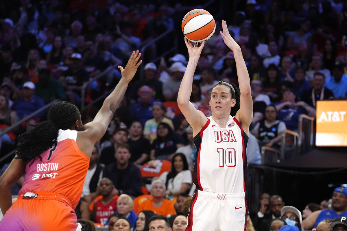 Breanna Stewart (10), of Team USA, looks to shoot a 3-point basket over Aliyah Boston, of Team ...