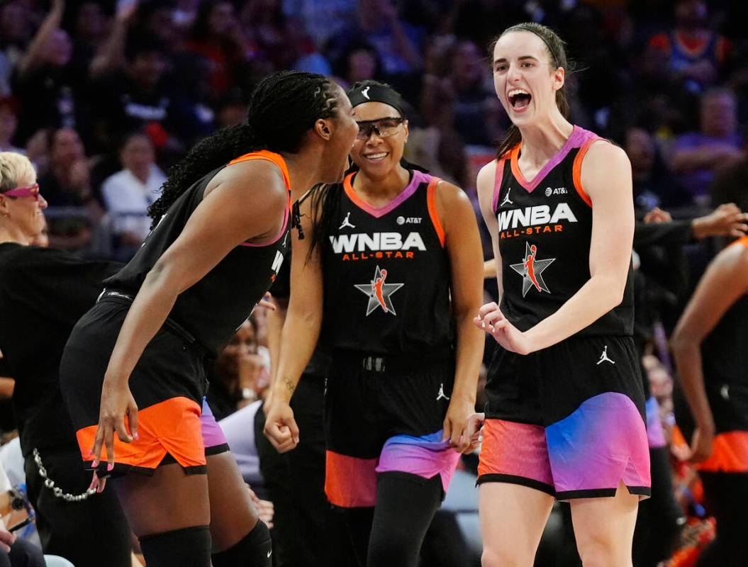 Caitlin Clark, right, Allisha Gray, center, and Aliyah Boston, left, of Team WNBA, celebrate a ...