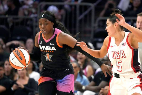 Arike Ogunbowale, left, of Team WNBA, left, steals a pass intended for Kelsey Plum (5), of Team ...