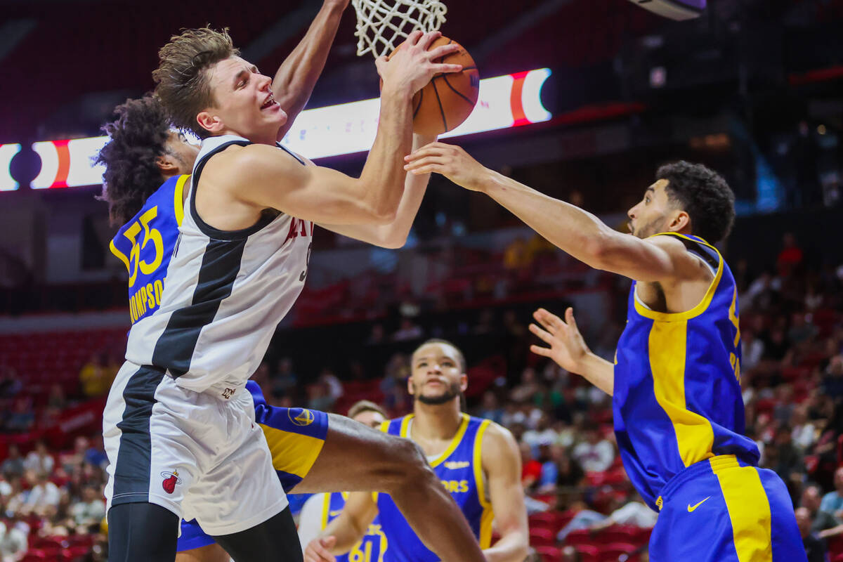 Miami Heat guard Pelle Larsson (9) grabs hold of the ball during an NBA Summer League basketbal ...