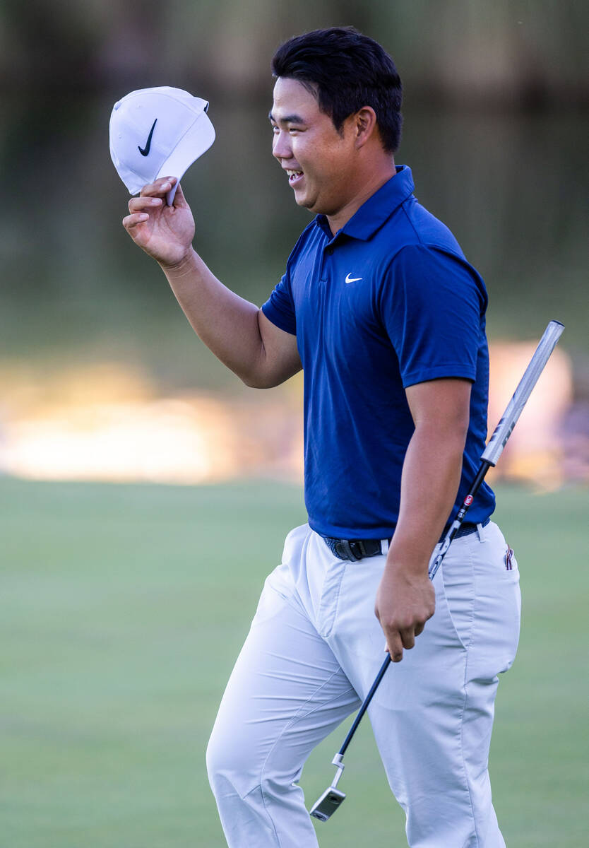 Tom Kim reacts to sinking his final putt for the win at hole 18 during final day play at the Sh ...