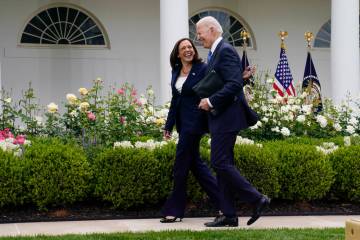 FILE - President Joe Biden walks with Vice President Kamala Harris in the Rose Garden of the Wh ...