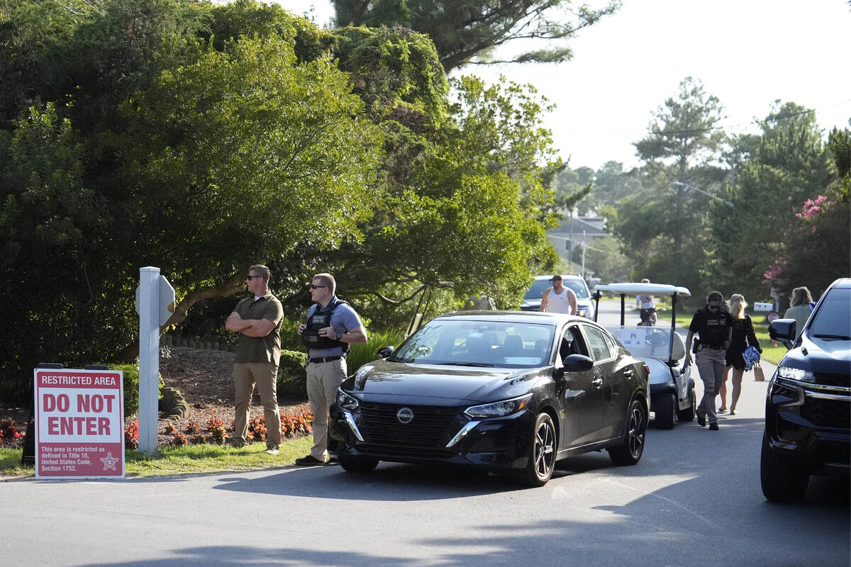 Law enforcement blocks off a street near President Joe Biden's beach house, Sunday, July 21, 20 ...