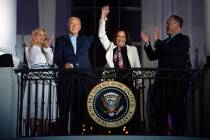 First lady Jill Biden, left, and second gentleman Douglass Emhoff, right, watch as President Jo ...