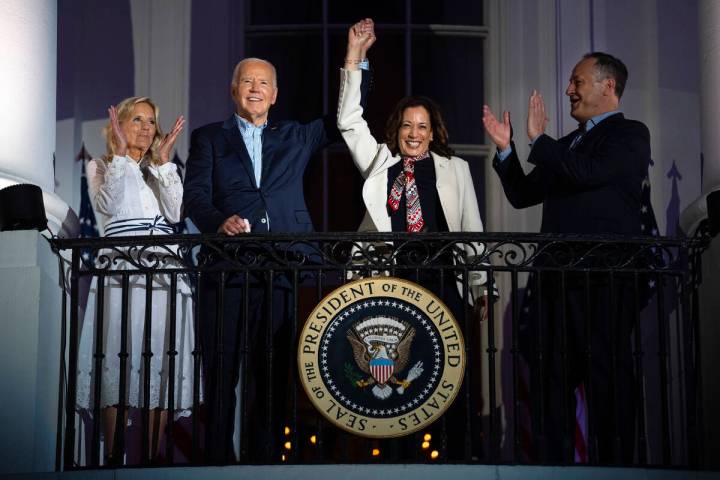 First lady Jill Biden, left, and second gentleman Douglass Emhoff, right, watch as President Jo ...