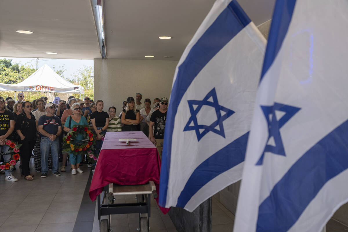 Family and friends of Yevgeny Ferde attend his funeral at a cemetery in Rishon Lezion, Israel, ...